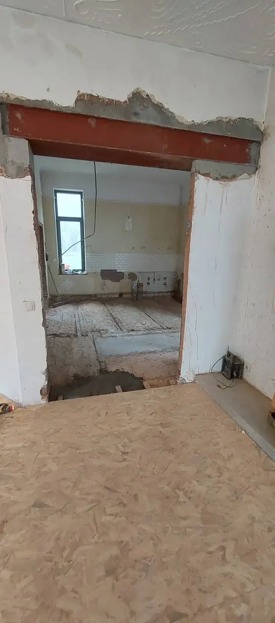 Ouverture avec poutre métallique et plancher en panneaux